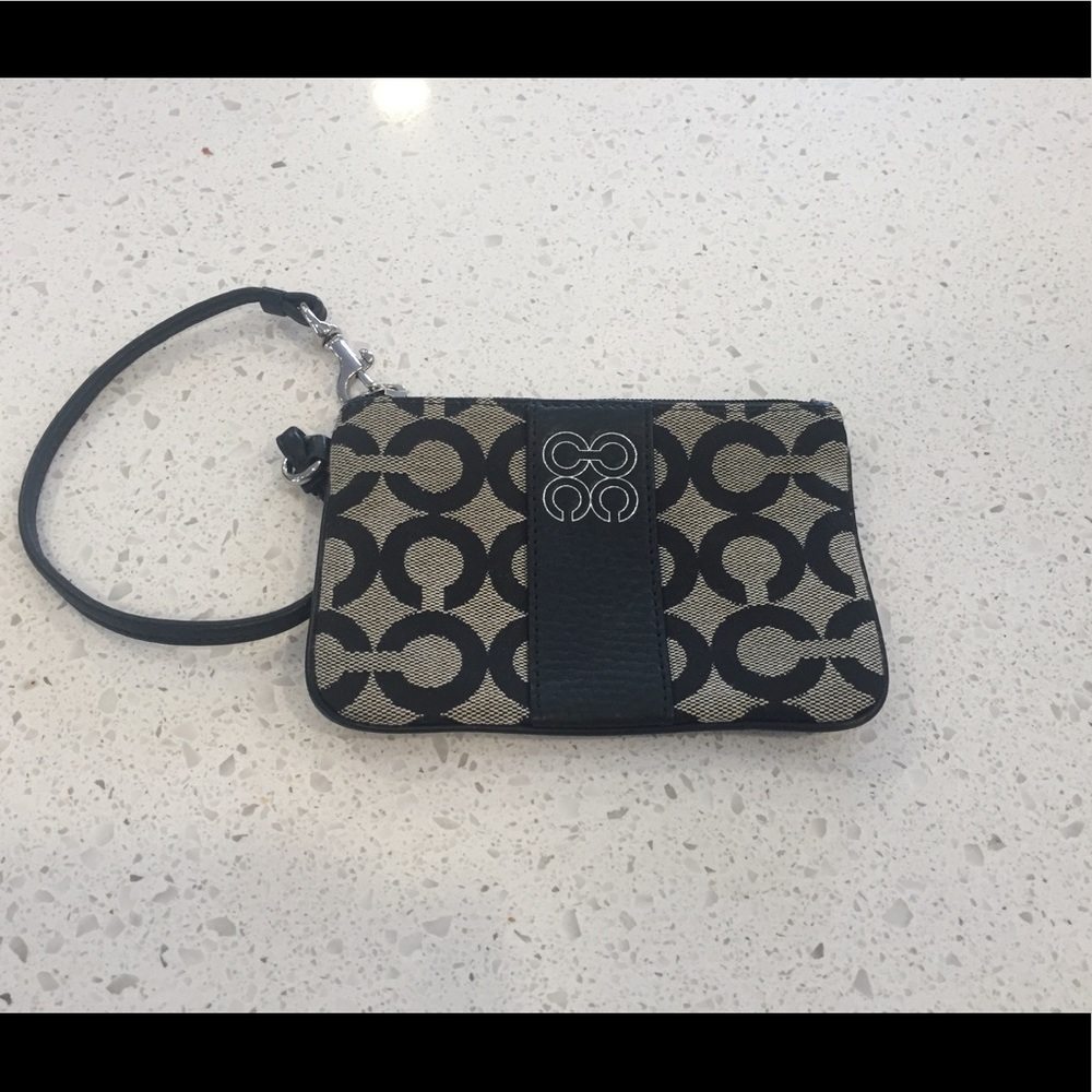 Black and grey Coach wristlet with 'C' pattern.